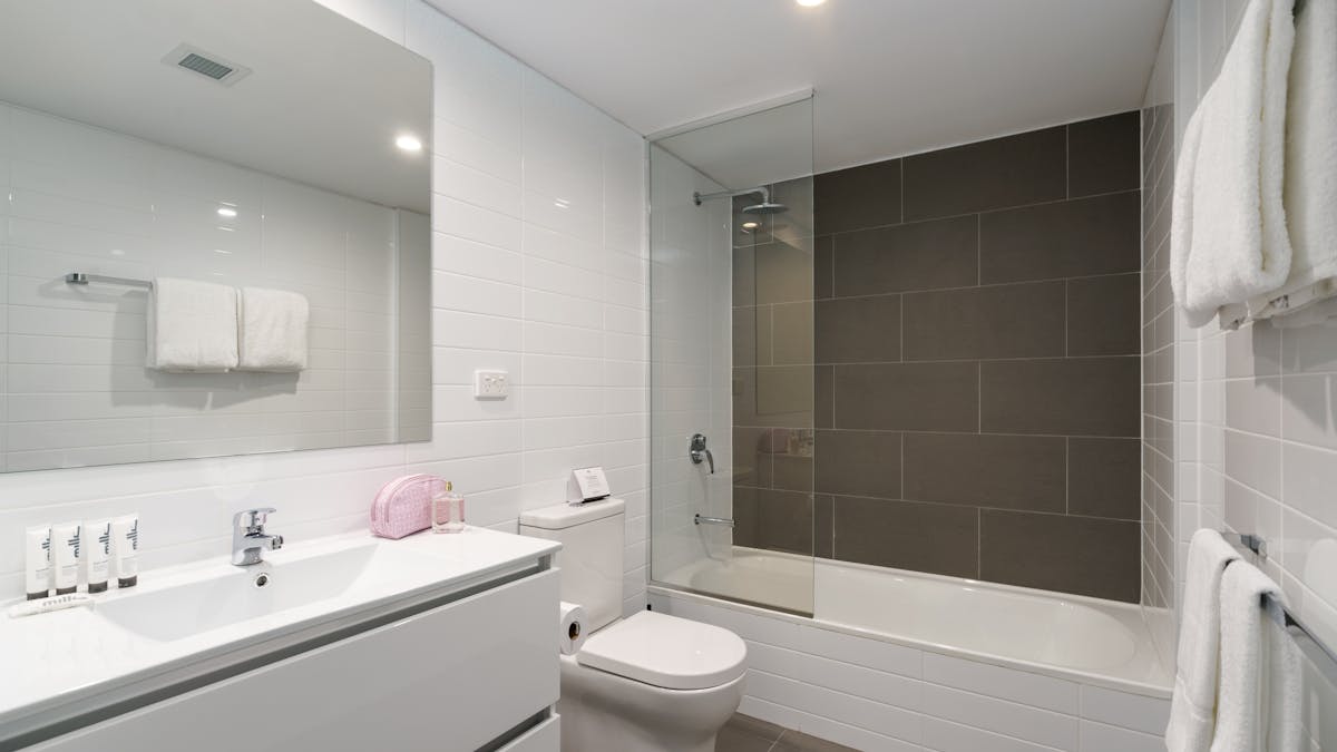 Featuring a shower over bath and premium MILK amenities