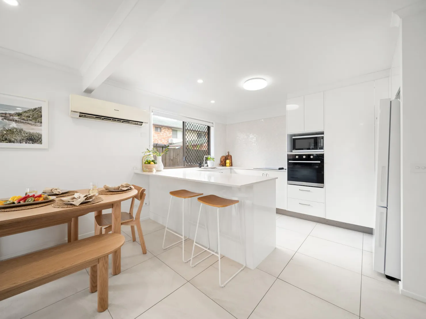 Open plan kitchen and dining area with breakfast bar