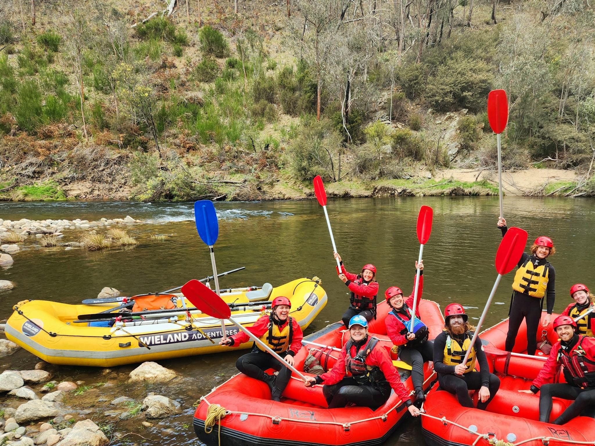 A red whitewater raft mid rapid in 'Dislocation' on the Mitta Mitta River.