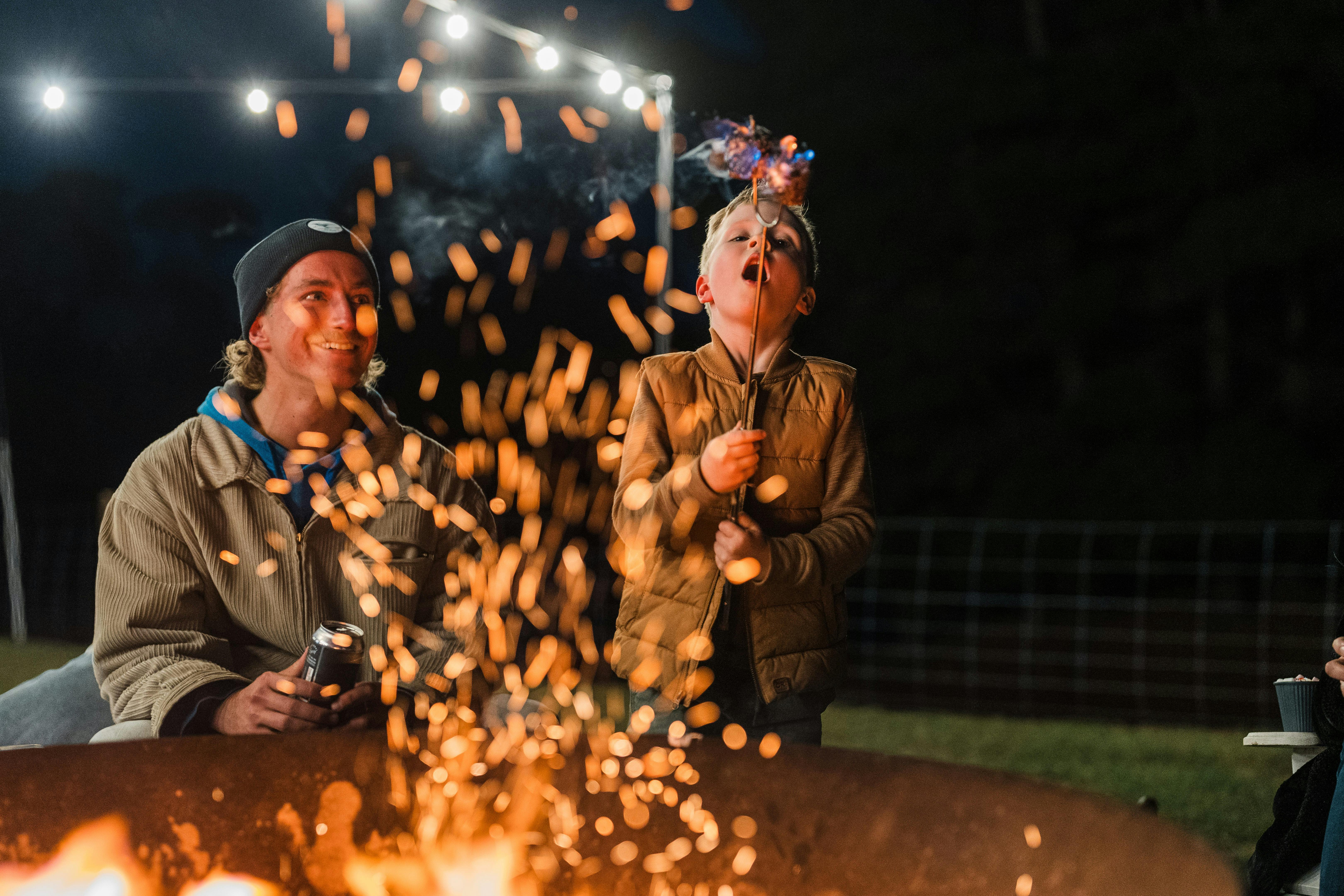 A boy toasts marshmallows at Ben Lomond Base