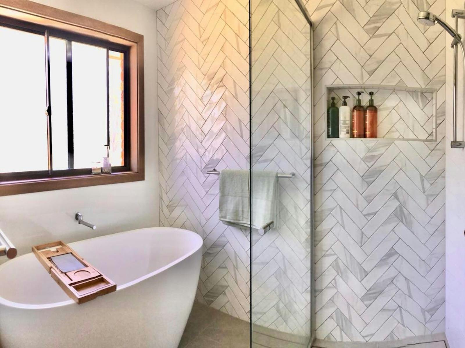 Modern Main Bathroom Features Bathtub and Shower Area Seperate to Toilet and Basin Areas