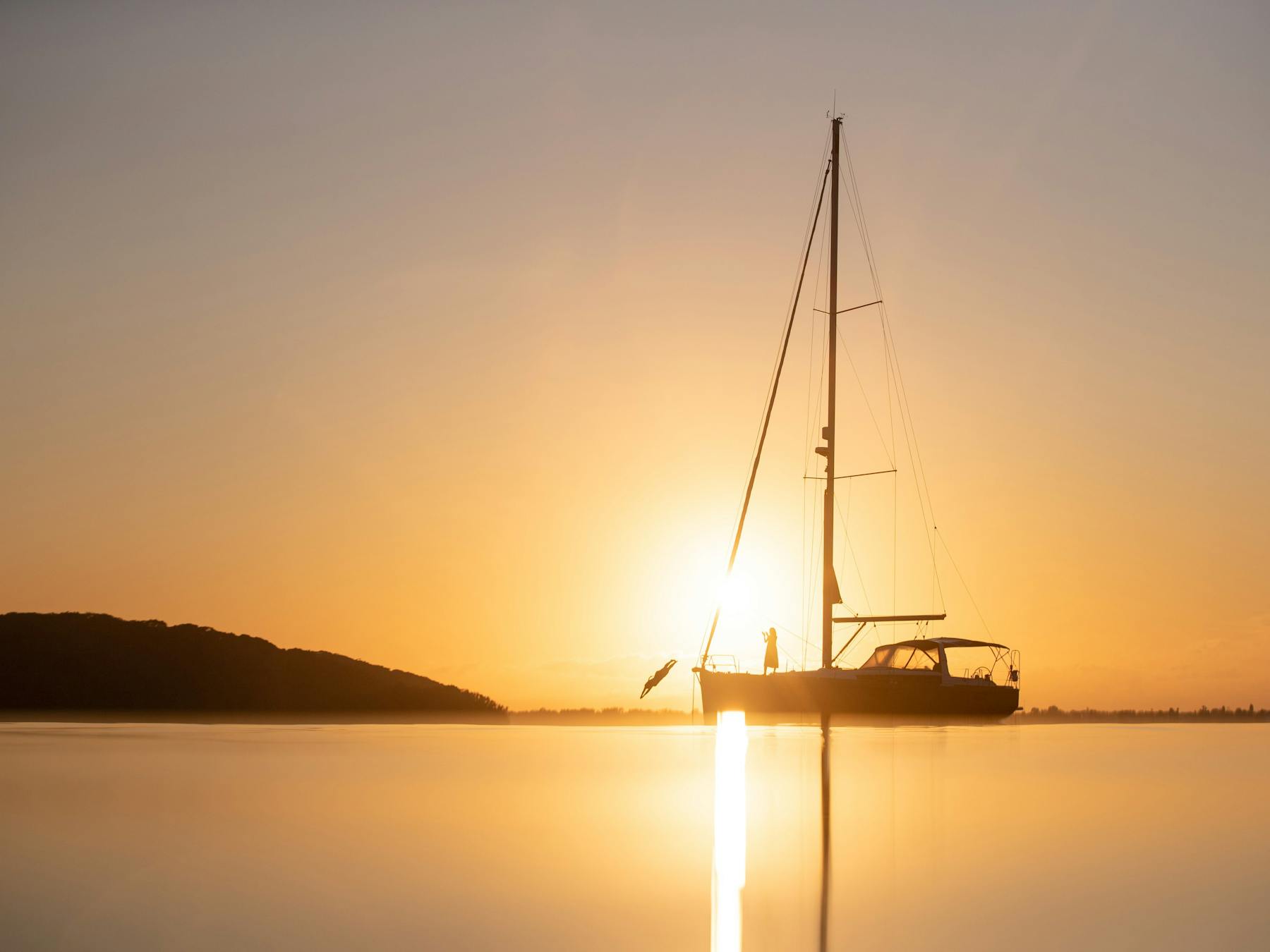 Diving off the bow of Sail Lake Macquarie into the waters of Lake Macquarie