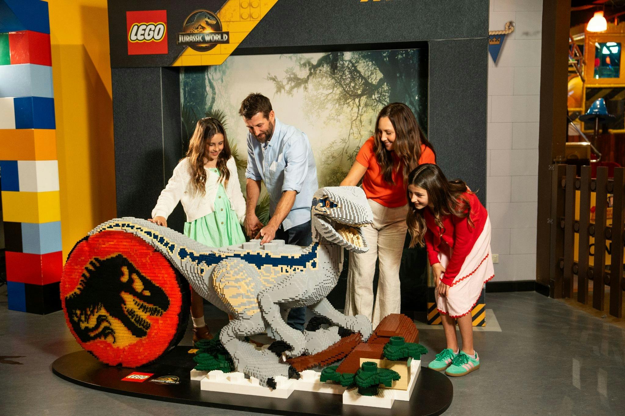 Family_Interacting_With_Brick-Built_Raptor_Blue