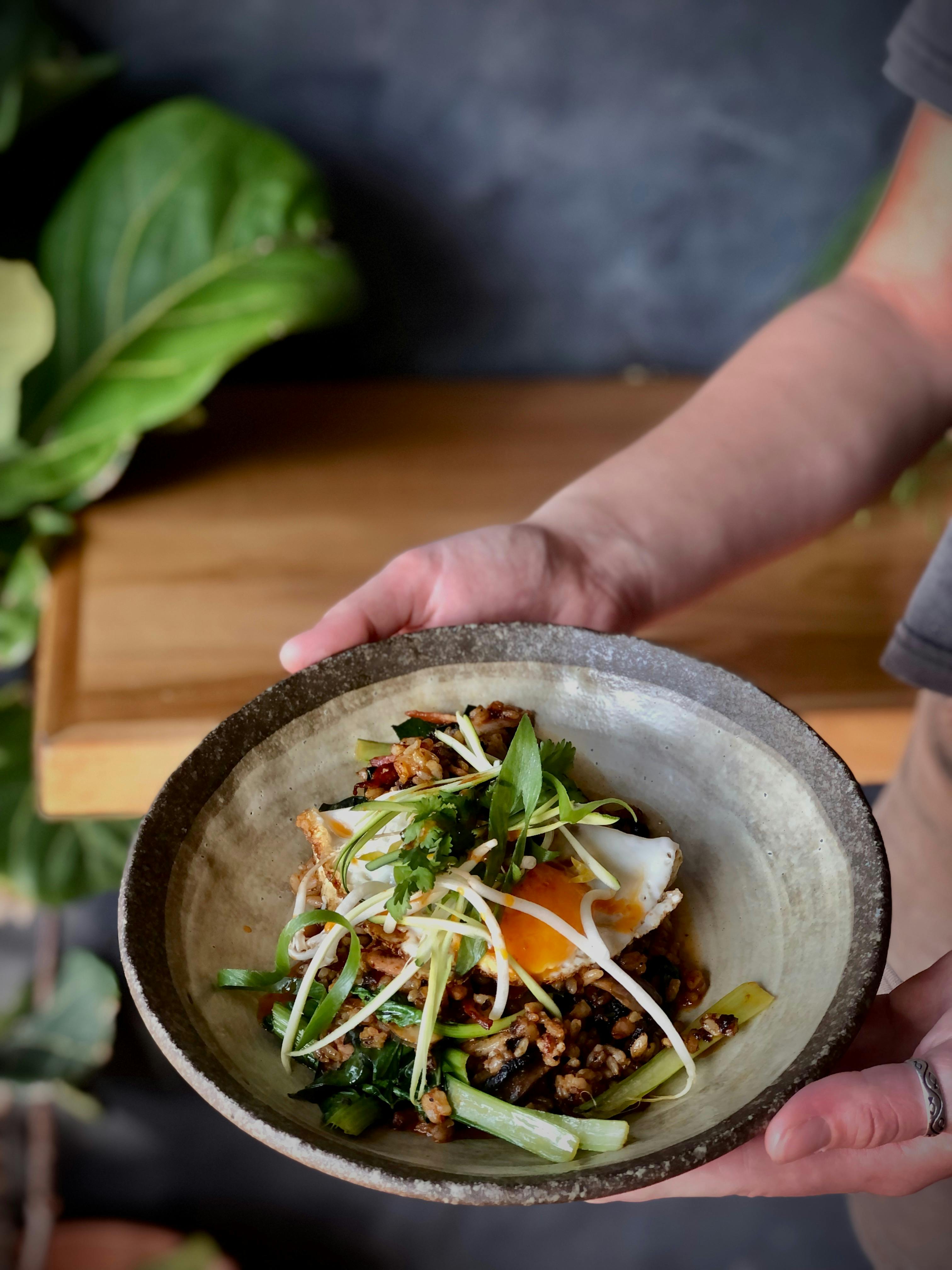 Nasi goreng with lions main xo sauce, a fried eggs and Asian greens