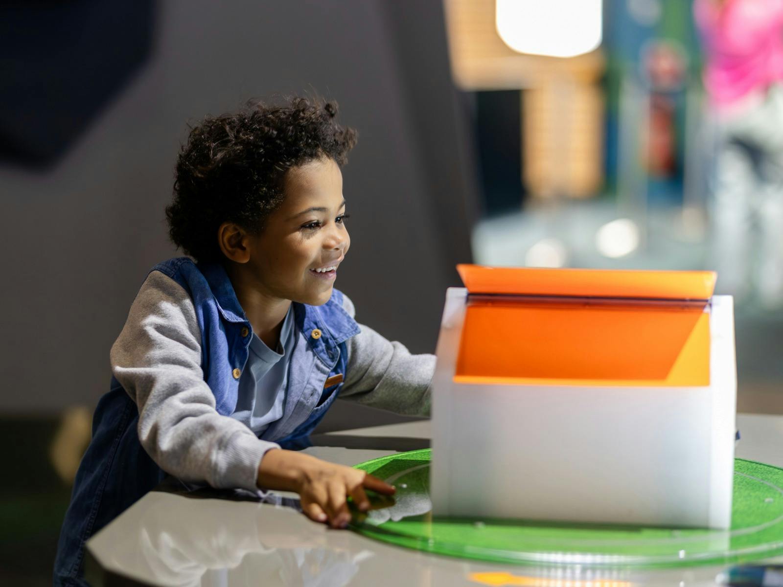 A child using an exhibit at Questacon