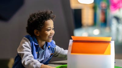 A child using an exhibit at Questacon