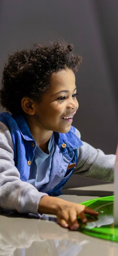 A child using an exhibit at Questacon