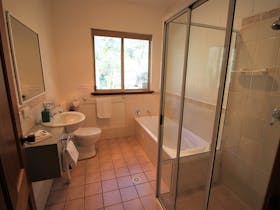 Two full size bathrooms, both with walk in showers and one with a separate bath tub