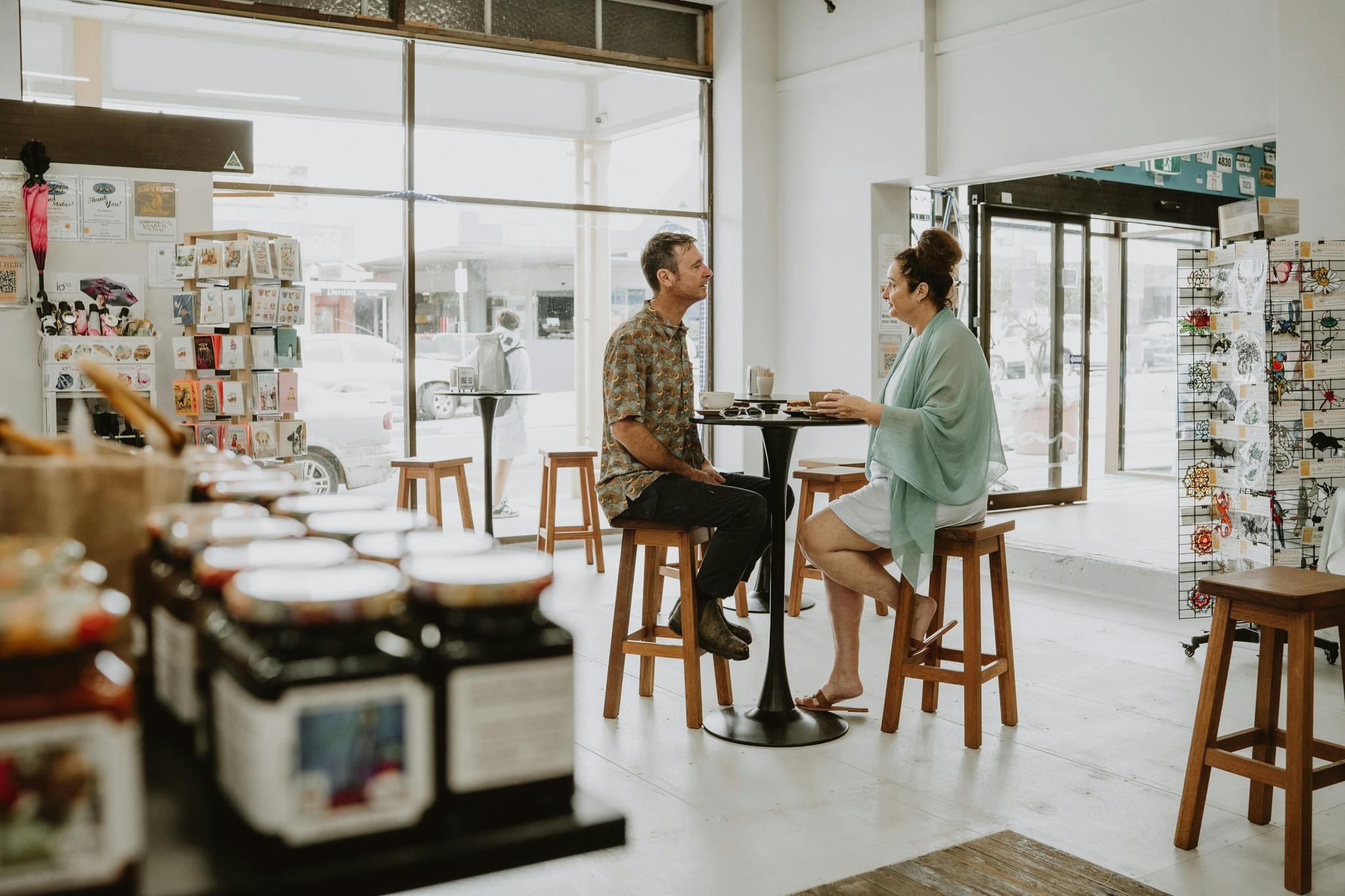 a couple enjoying the award winning locally roasted coffee by painted blue coffee roasters