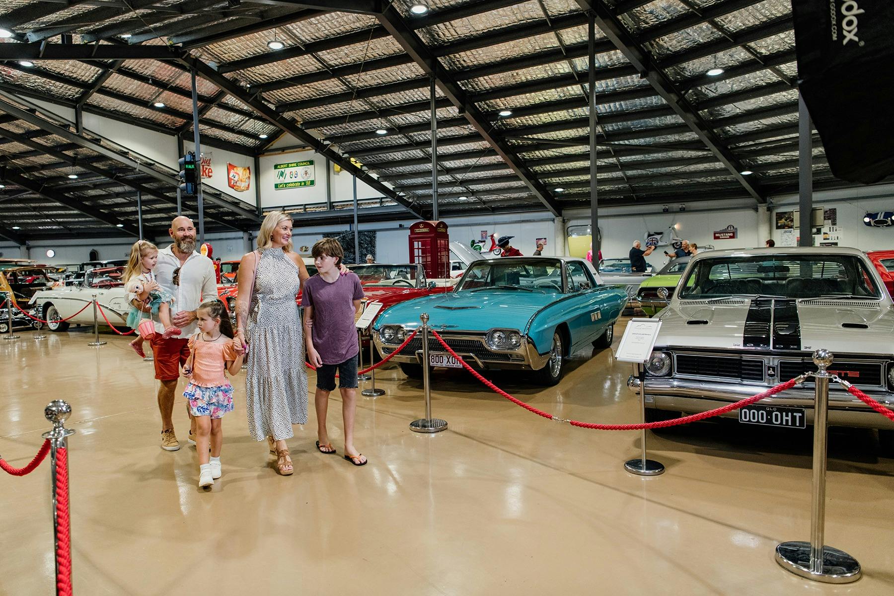 Family walks through Gold Coast Motor Museum