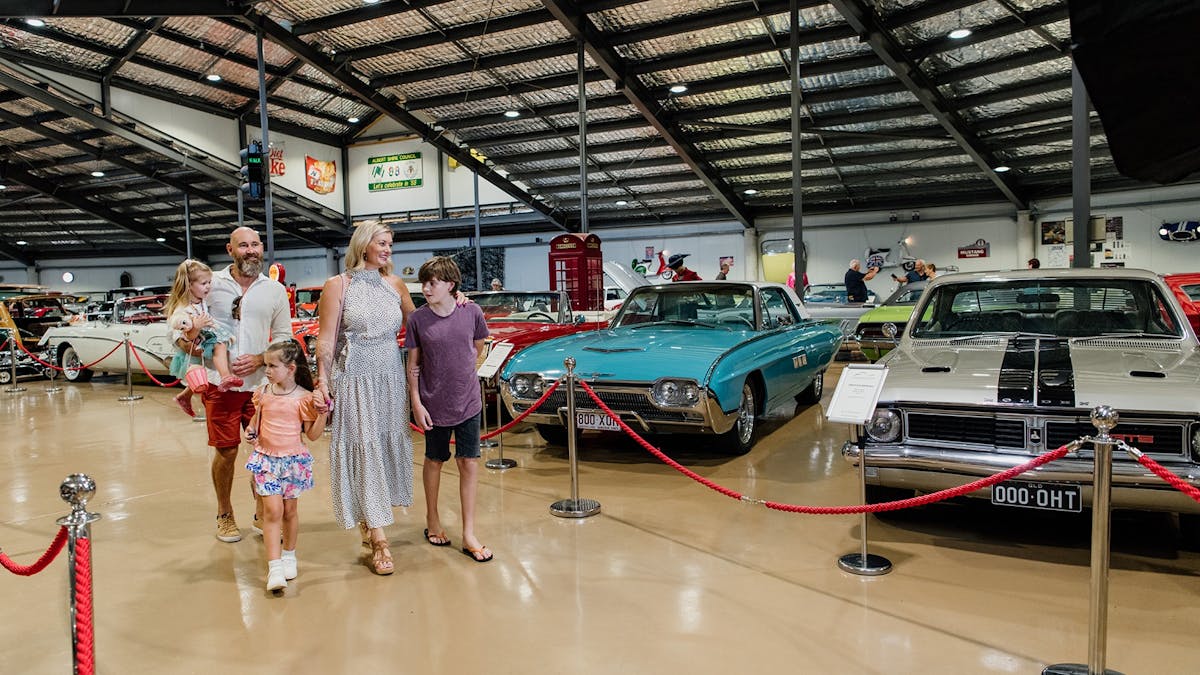 Family walks through Gold Coast Motor Museum