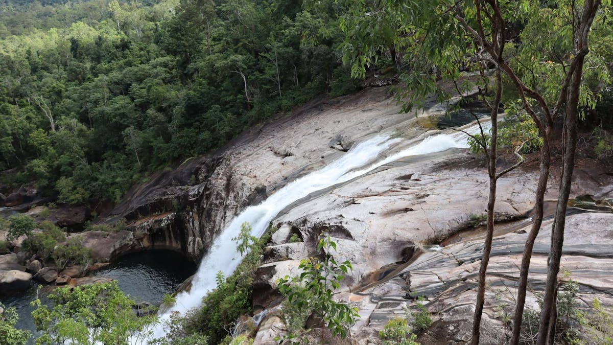 Looking at water cascading down into a pool.