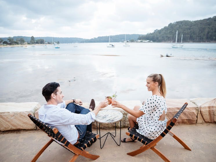 Couple Enjoying evening drinks at The BOX on the Water restaurant and bar, Ettalong Beach