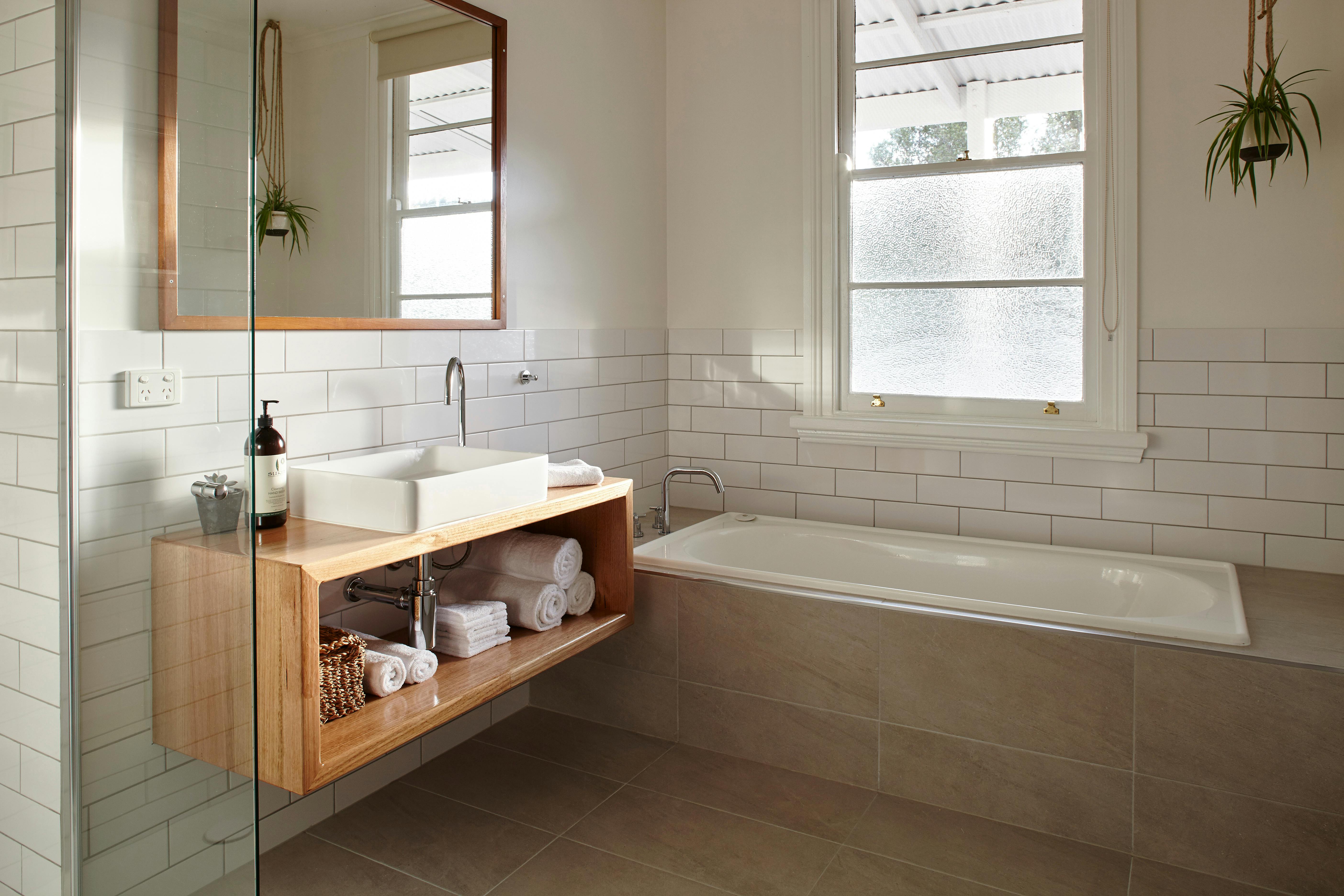 Rennovated bathrooms with fluffy towels and Sukin products