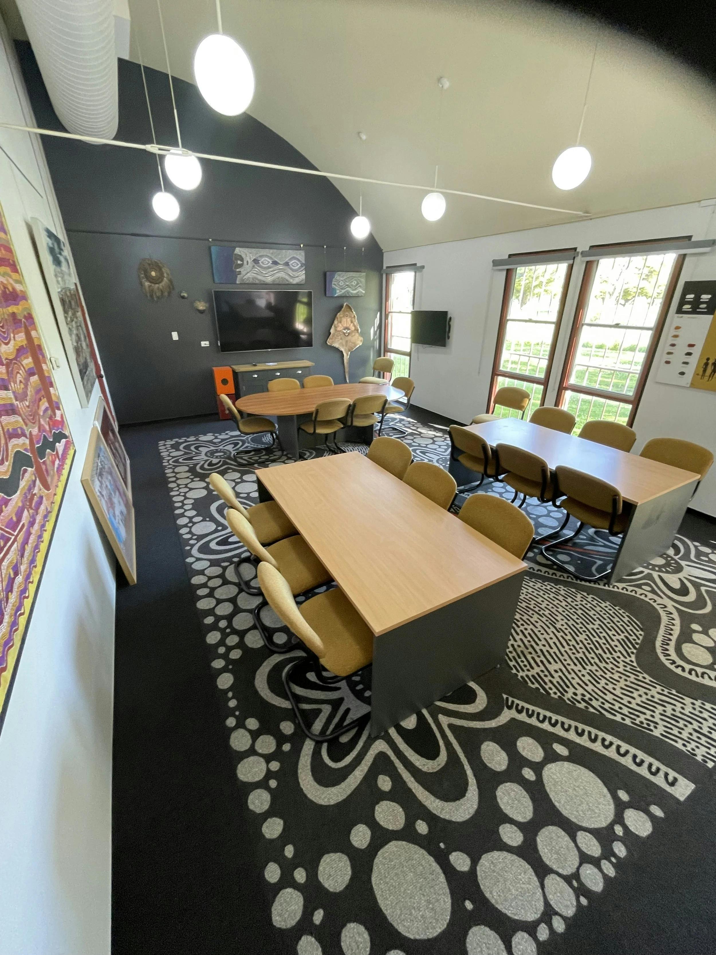 three tables inside conference room