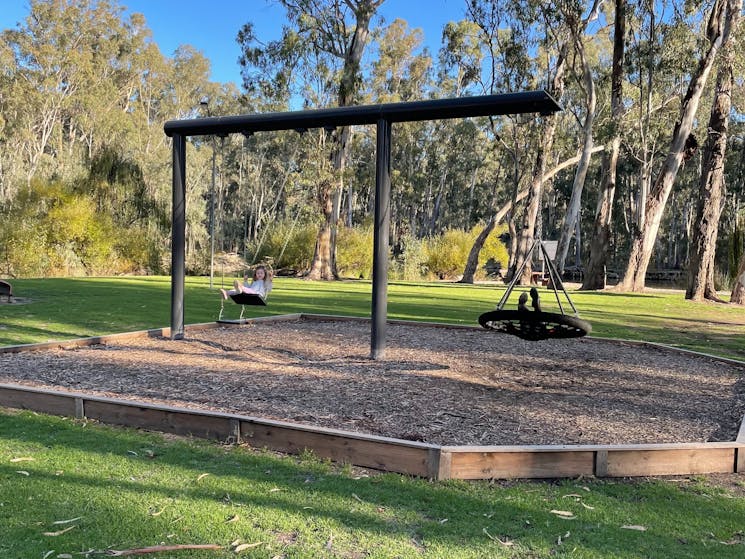 2 Playgrounds and swing set within the park