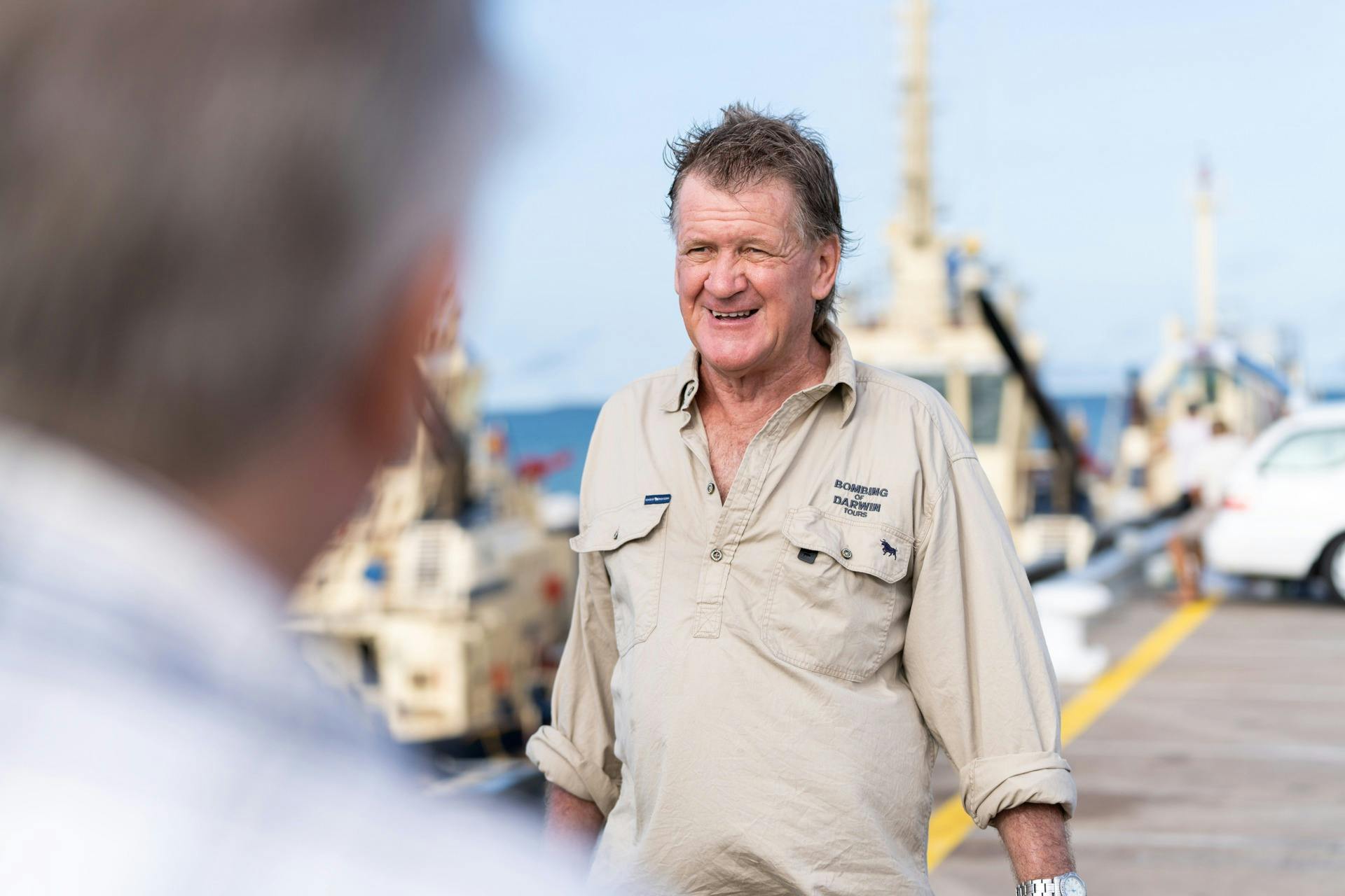 Garry Gallagher talking to passengers on Bombing of Darwin WWII Heritage Tour.