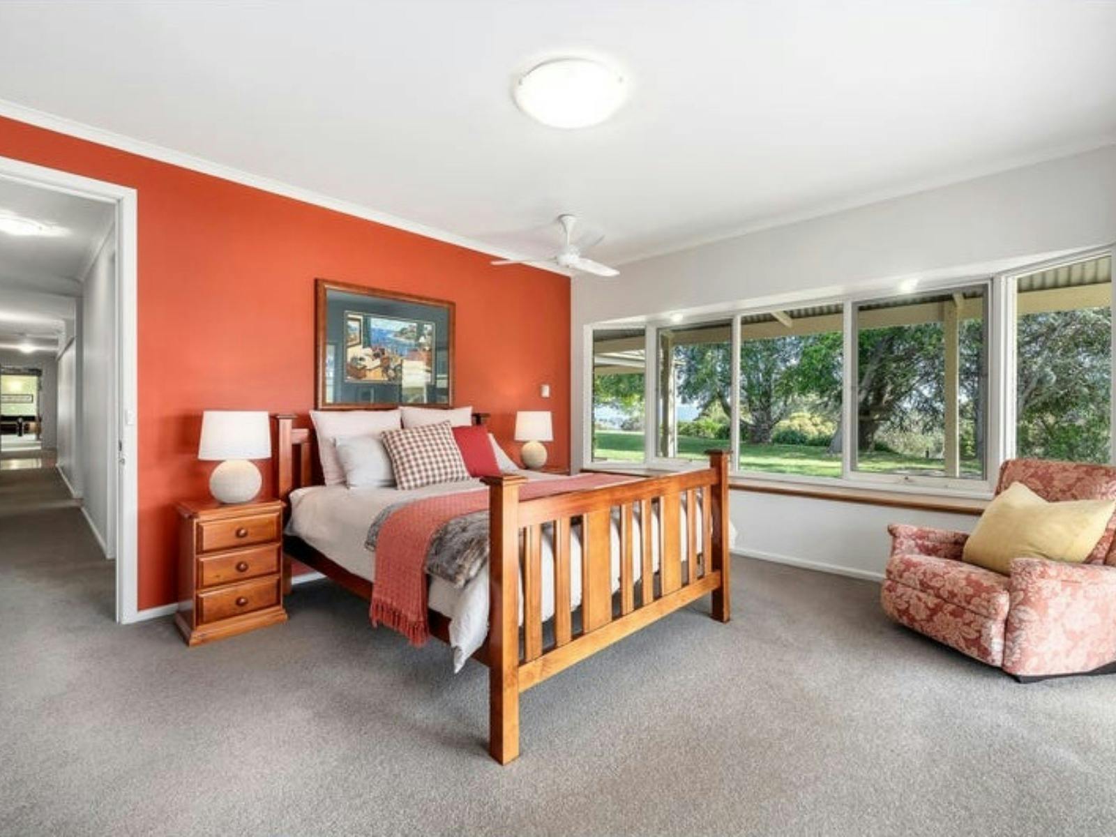 One of the 5 bedrooms with natural light at Sambar Ridge farm stay in Alexandra, Victoria.