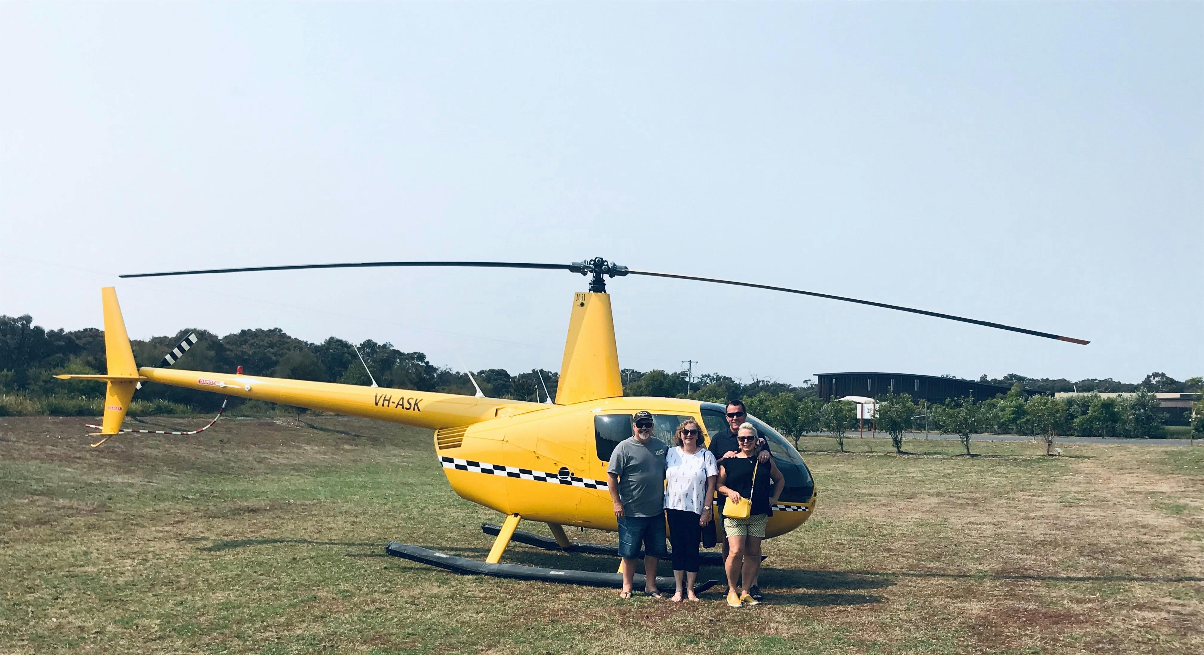 Friends taking on a new challenge together flying over the coast