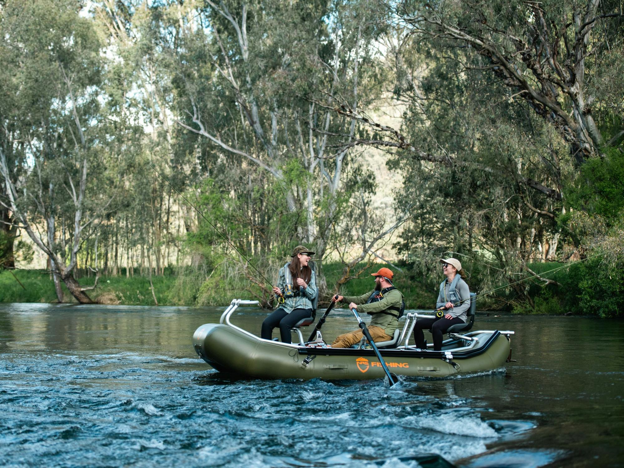 Fly fishing for trout on a drift boat on the the Tumut river in the Snowy Mountains