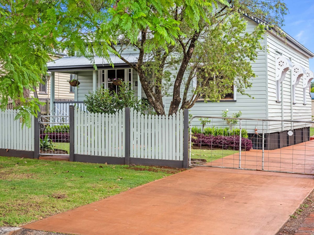 Fully fenced - driveway to rear shed.