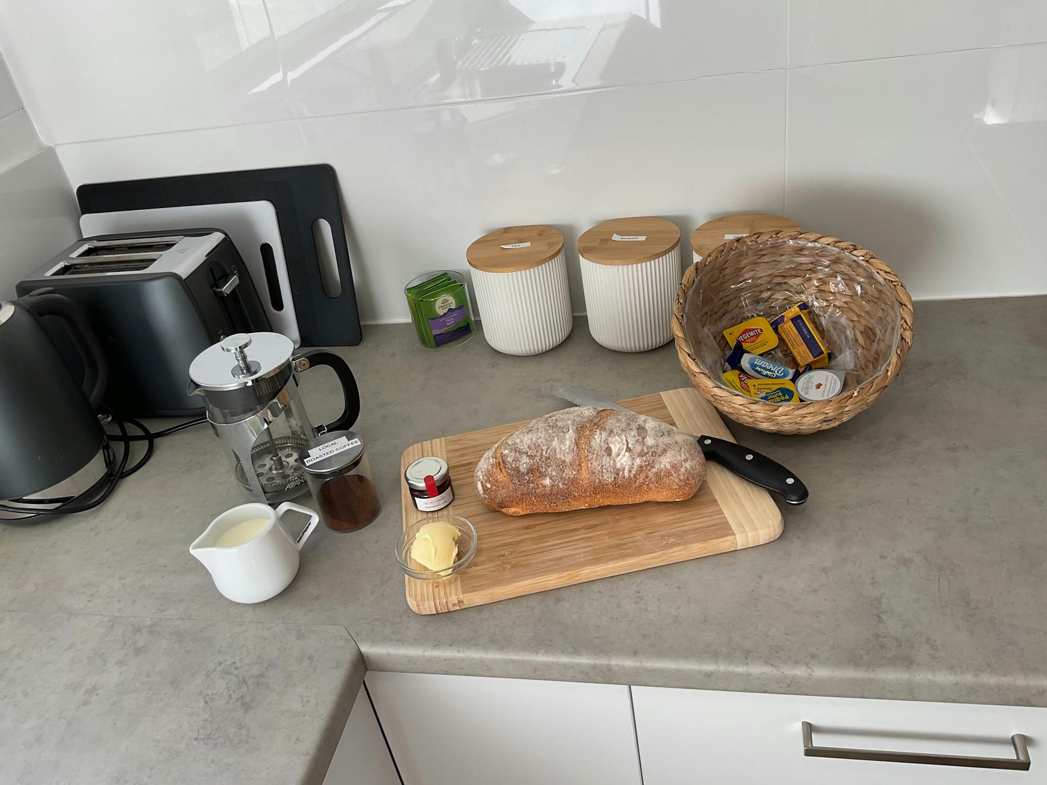 In room continental breakfast on the kitchen bench, with fresh bread, tea and coffee.