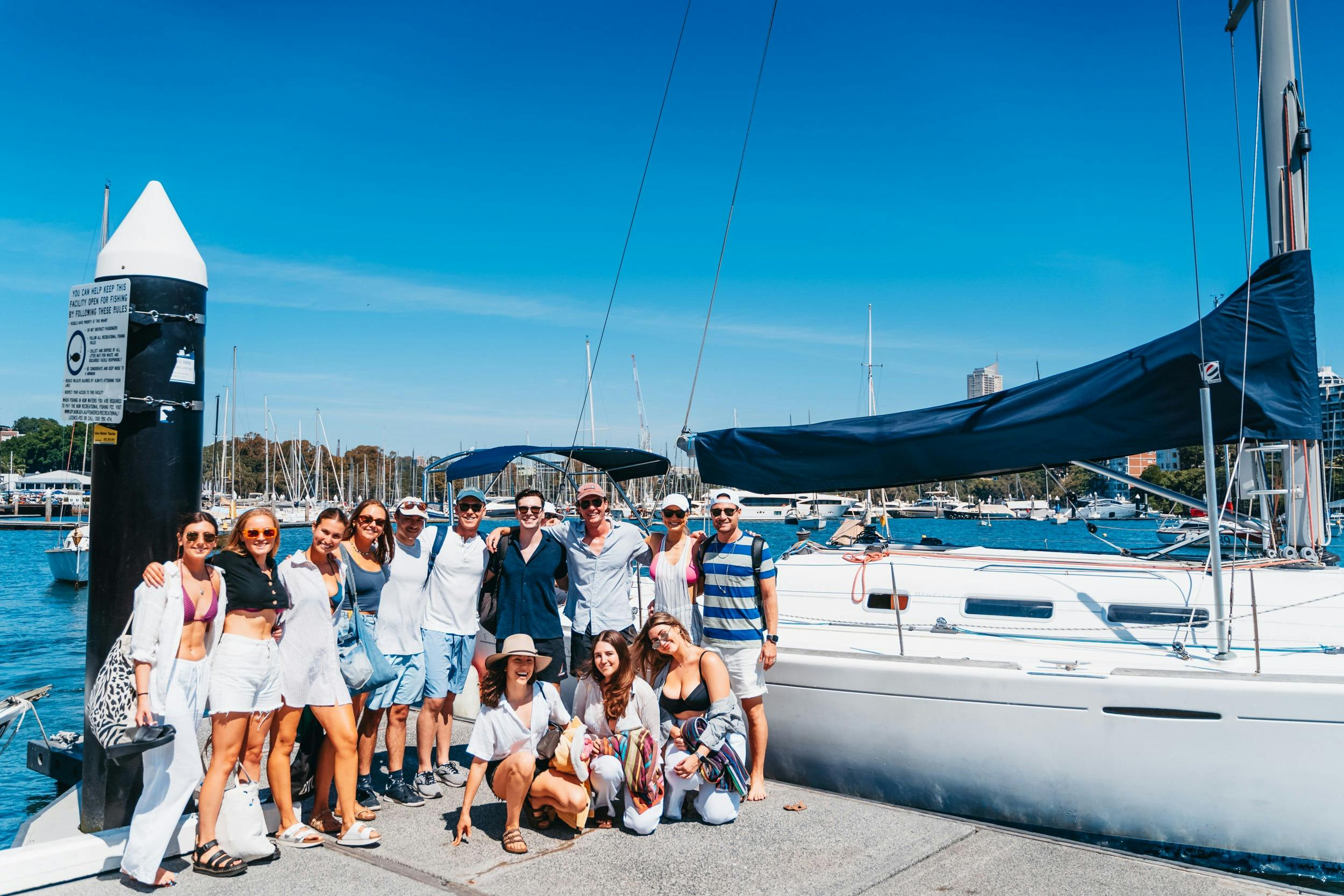 Group in front of yacht