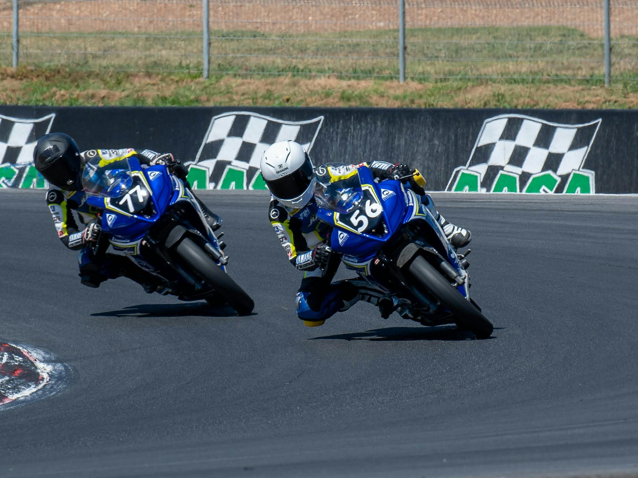 Two motorbikes racing around Winton Motor Raceway