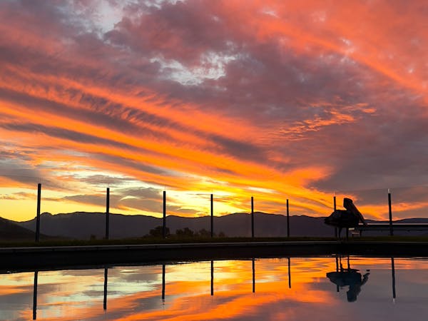 Unwind by the pool and soak in the stunning sunset views at Mount French Lodge