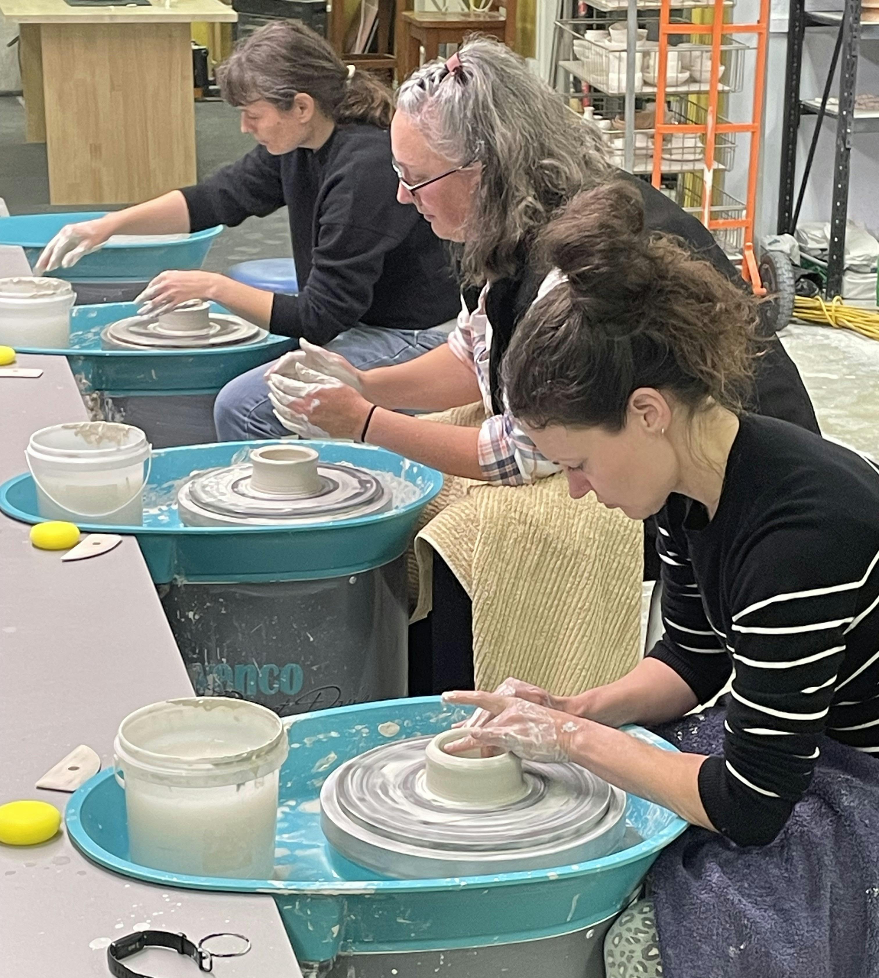 Image showing potters working at pottery wheels