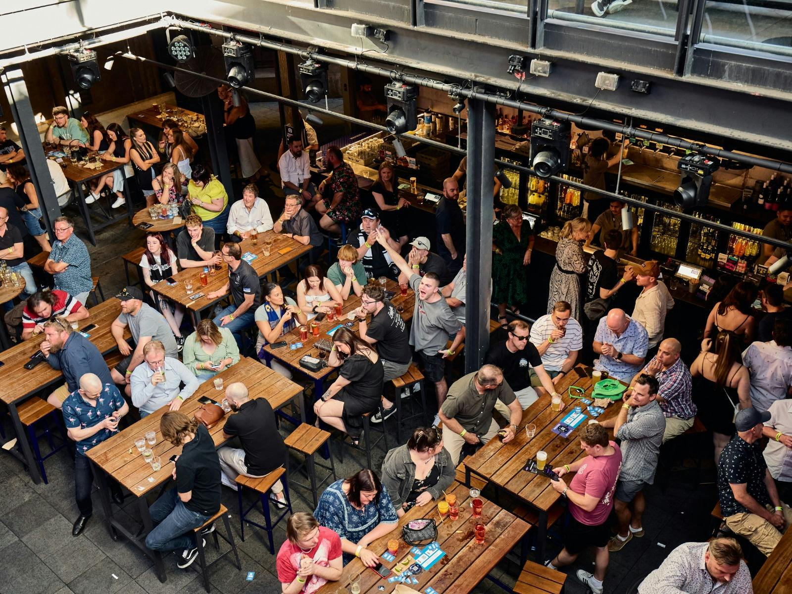 fans watching footy grand final at the district brew bar