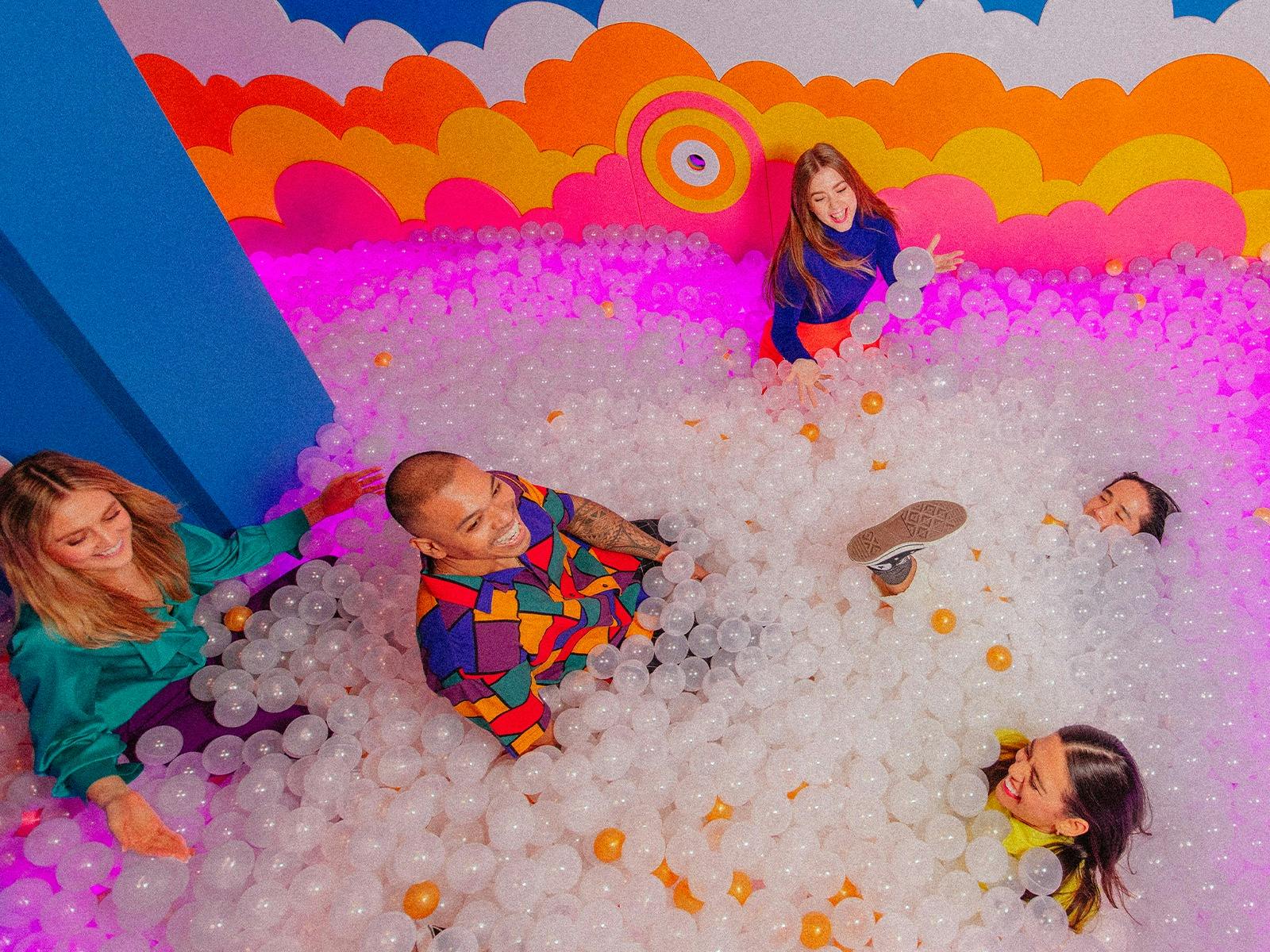 Group of people in a ball pit Group of people in a ball pit
