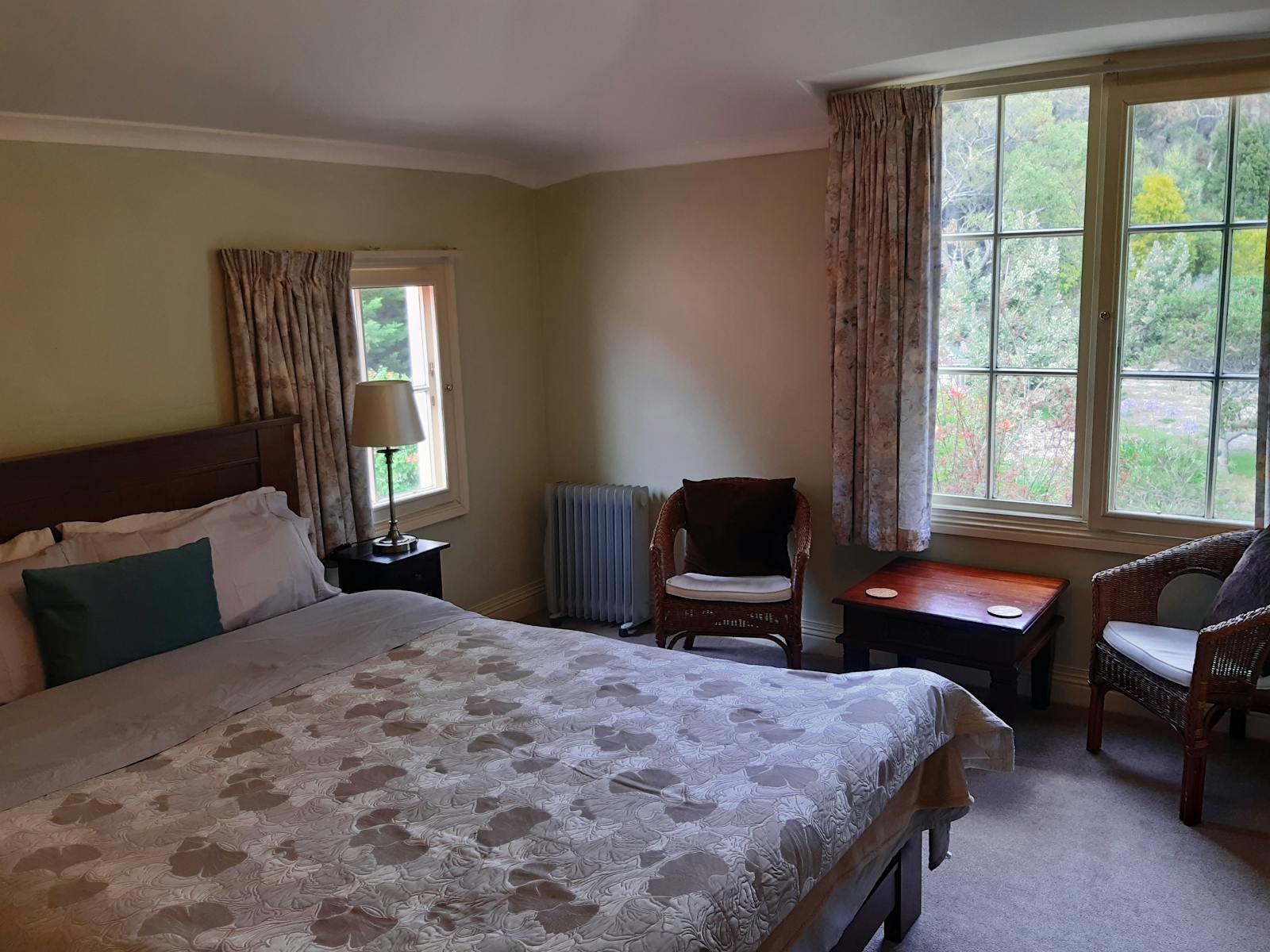 Double bed with ensuite, and comfortable chairs with coffee table