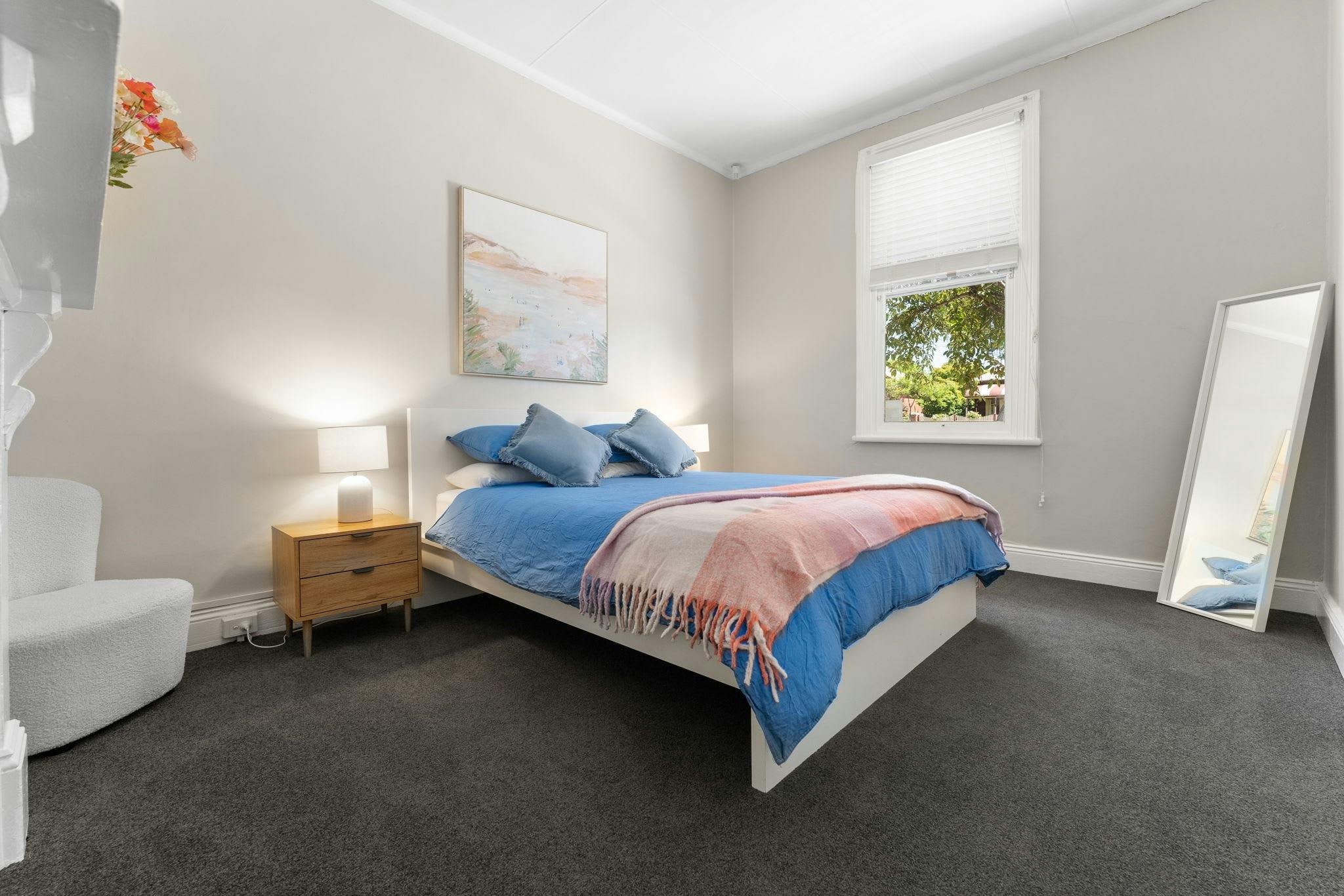 Queen Bedroom with full length mirror and window for natural light