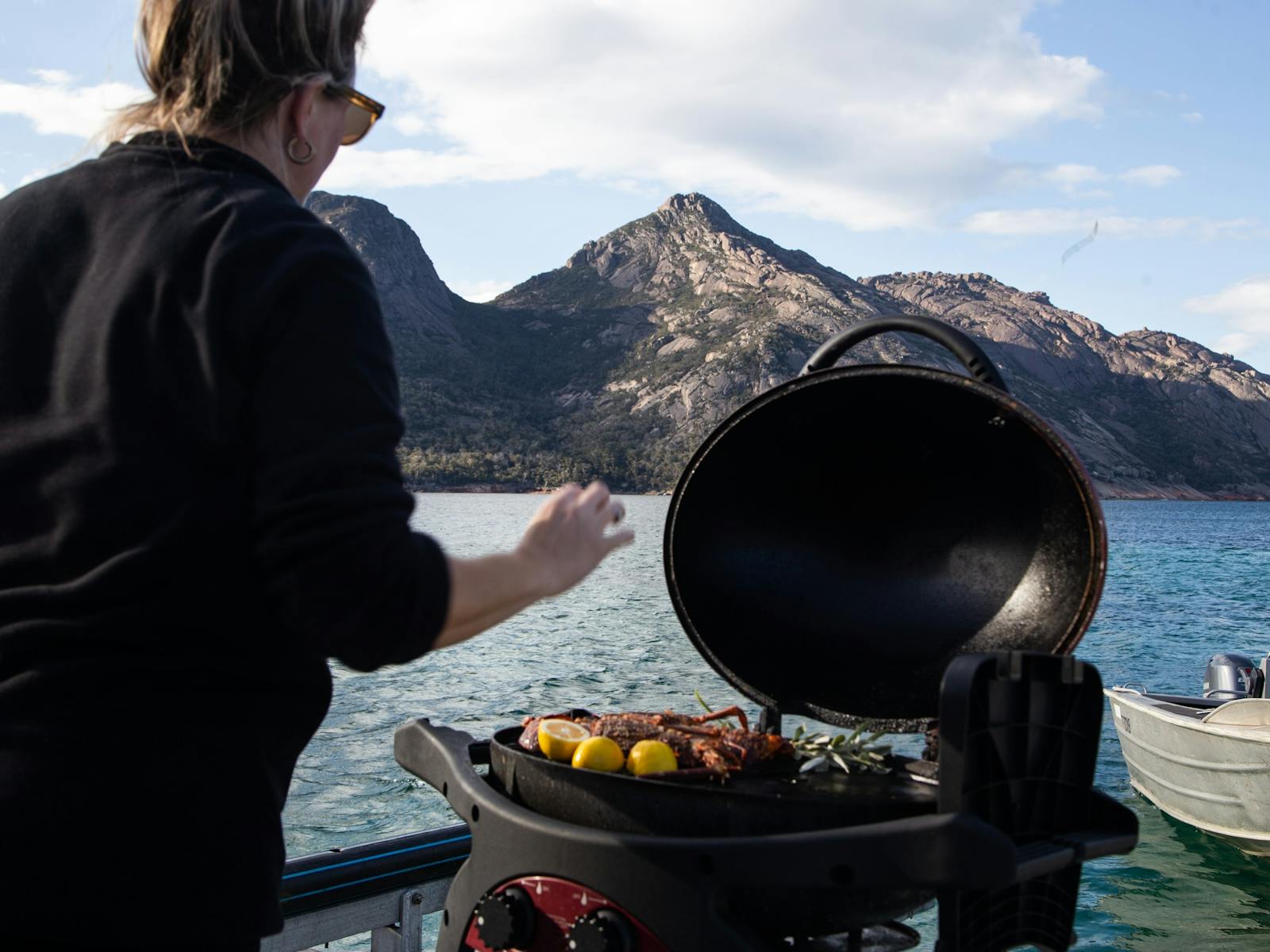 Seafood BBQ with mountains in background