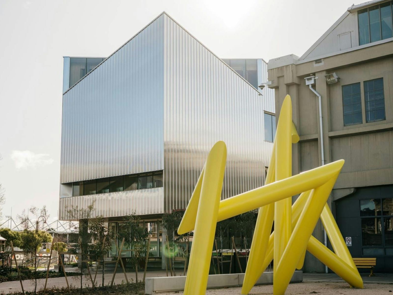 UTAS inversek campus building with Yellow  triangular  sculpture