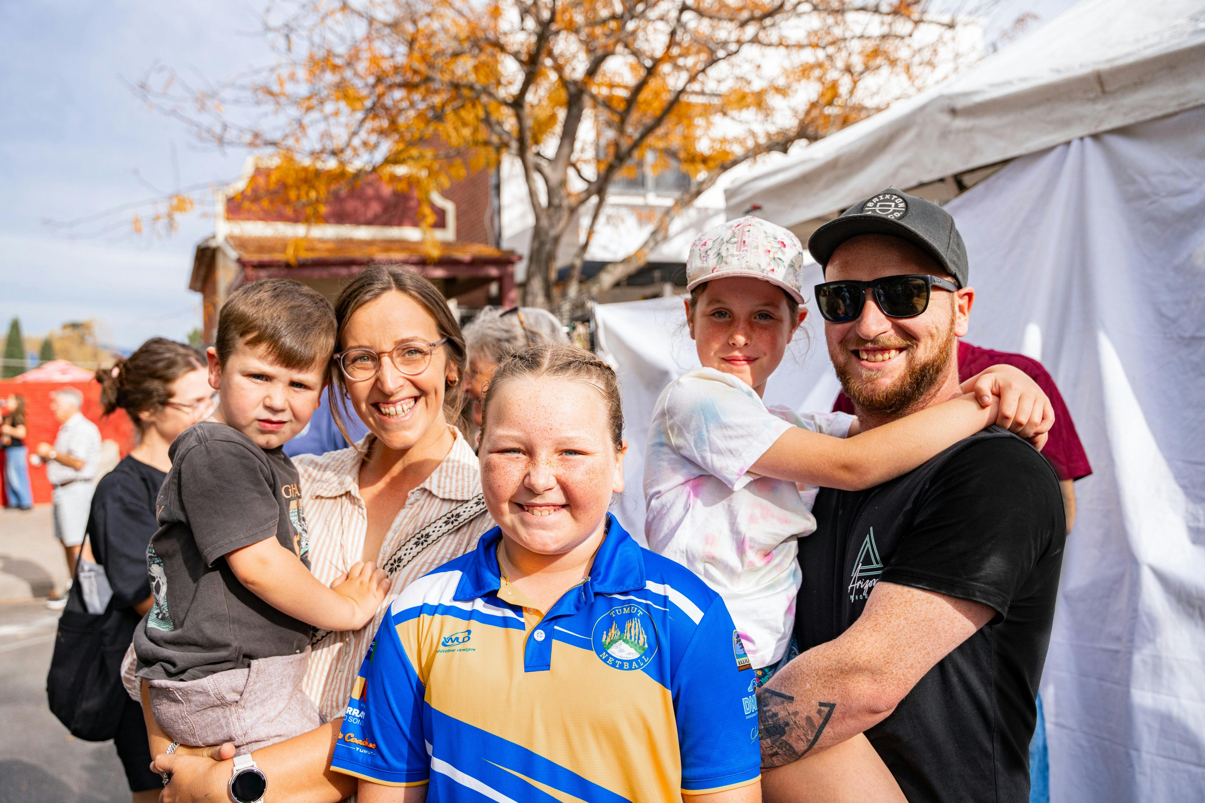A family of 5 including mum, dad, two daughers and a son at Falling Leaf Festival