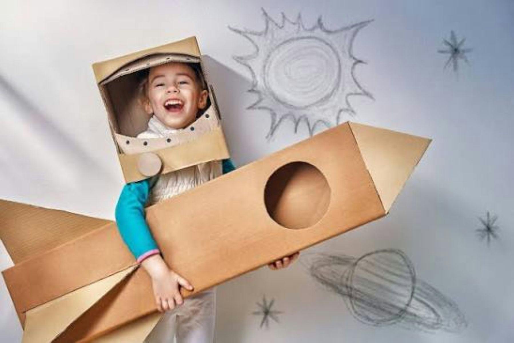 Image of child and cardboard creations