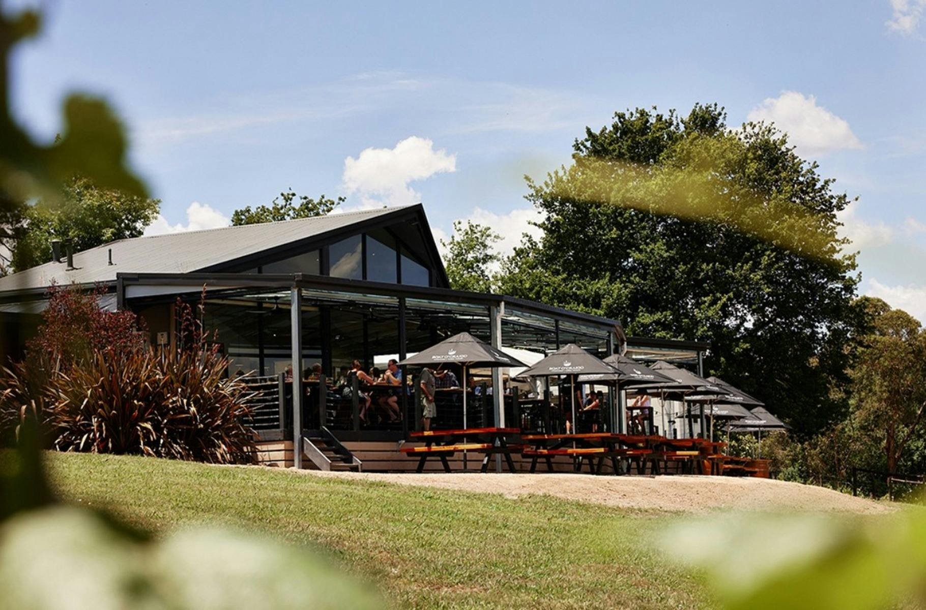 Boat OCraigo winery exterior with grass in foreground and blue sky