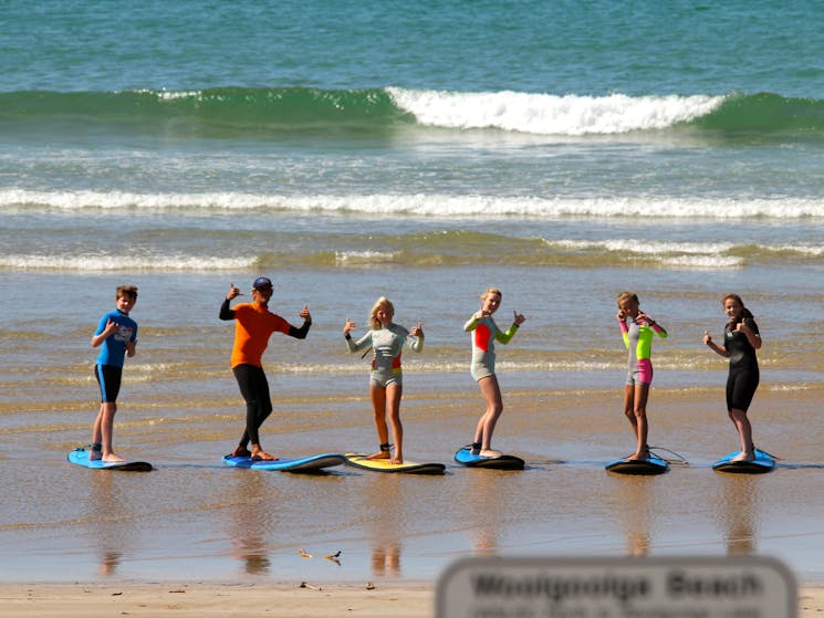 Surfing stoke at Woolgoolga Beach with our experienced coaches