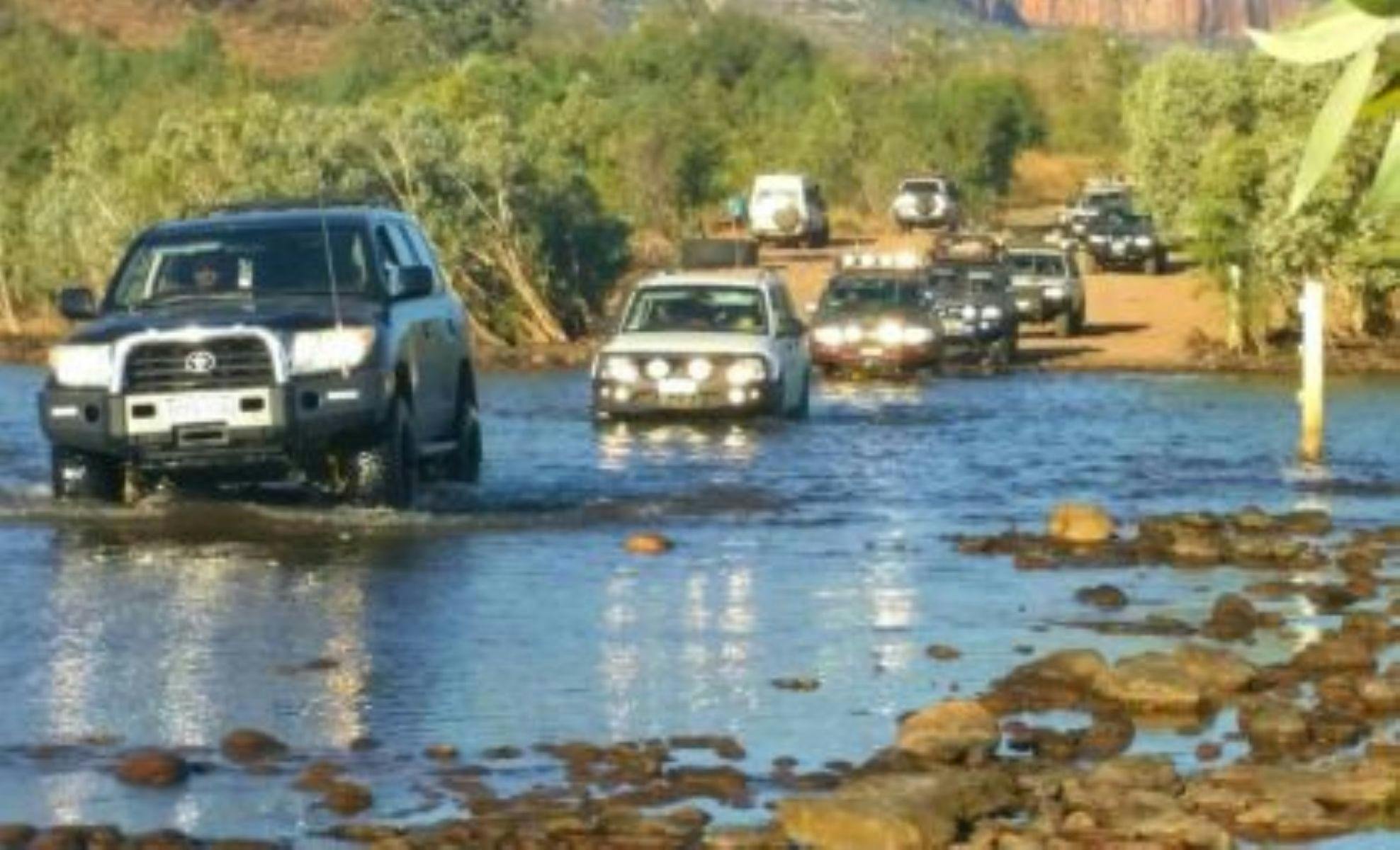 Guests driving through water crossing