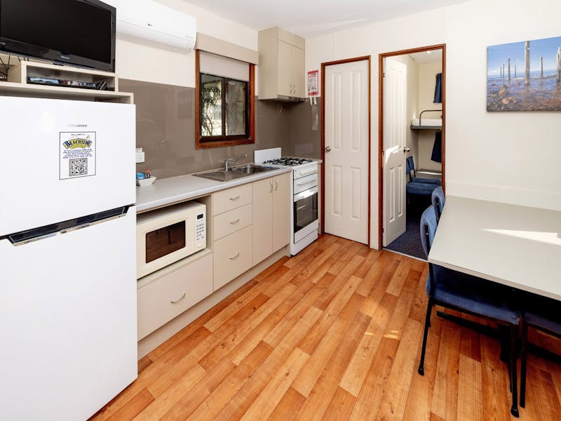 Kitchen and dining space in Deluxe Cabin