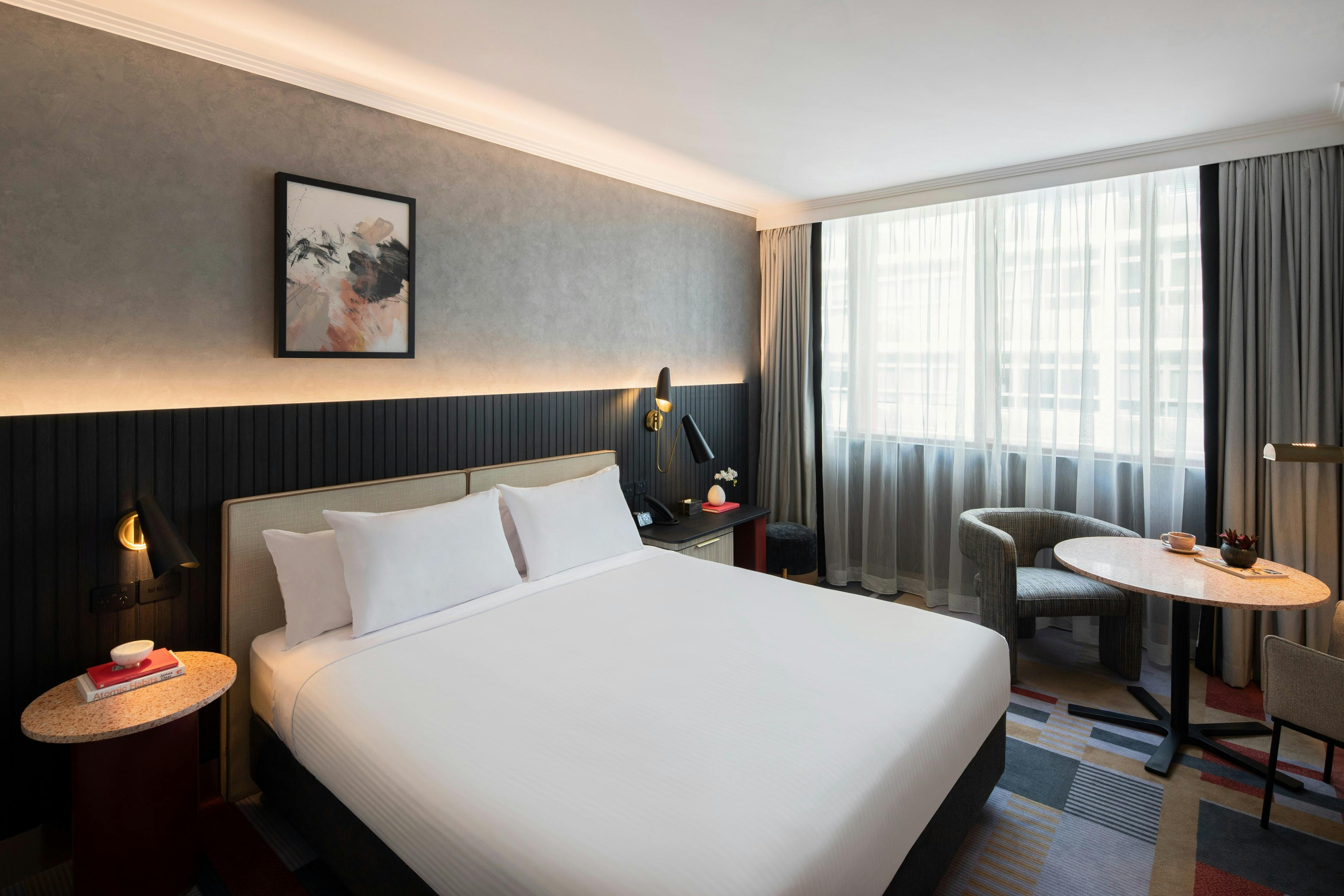 Picture of Bed with side table, seating area