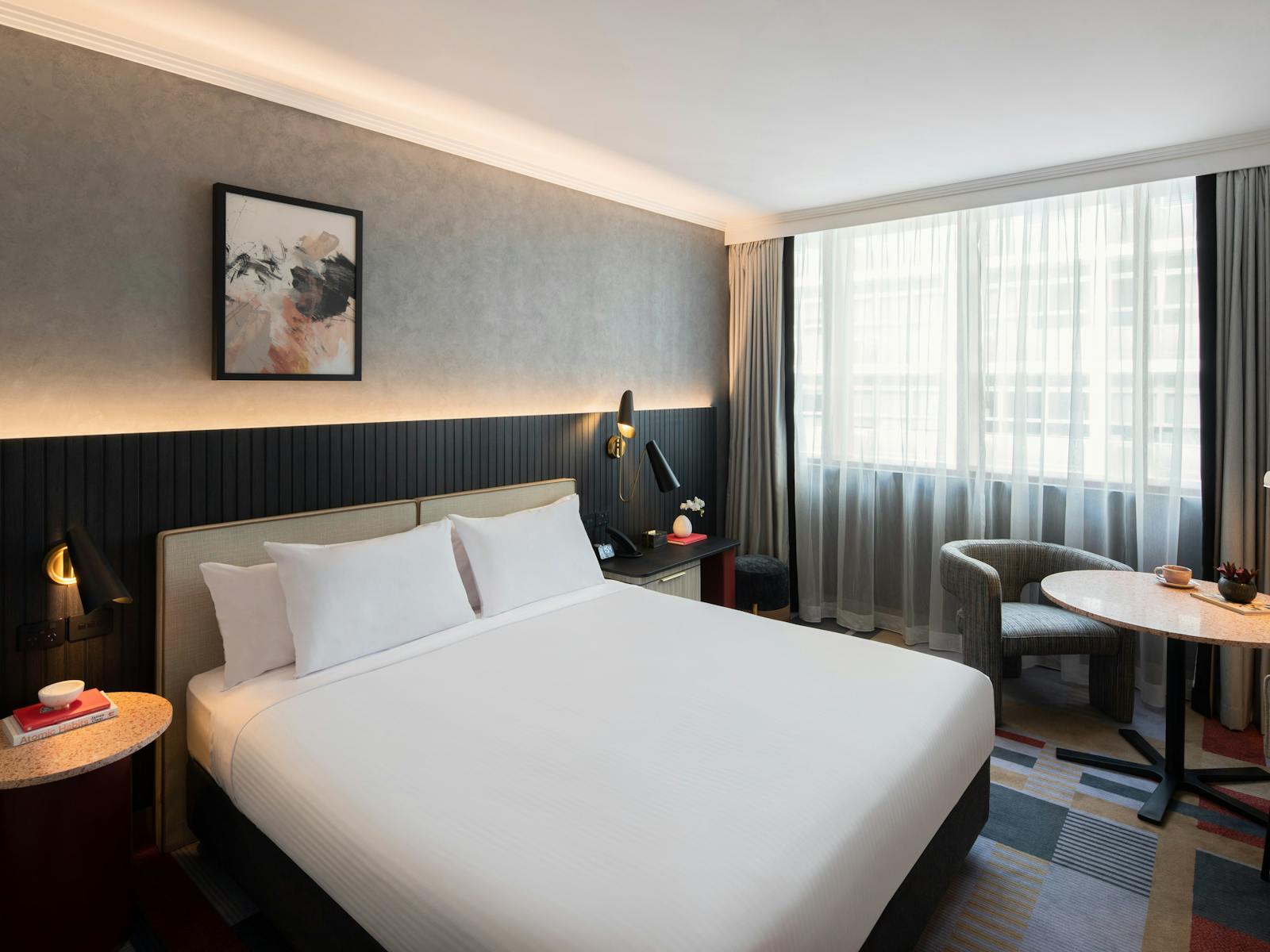 Picture of Bed with side table, seating area