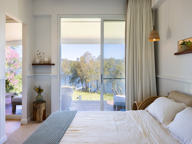 Lakefront Villa Bedroom includes direct access to the outdoor bath.