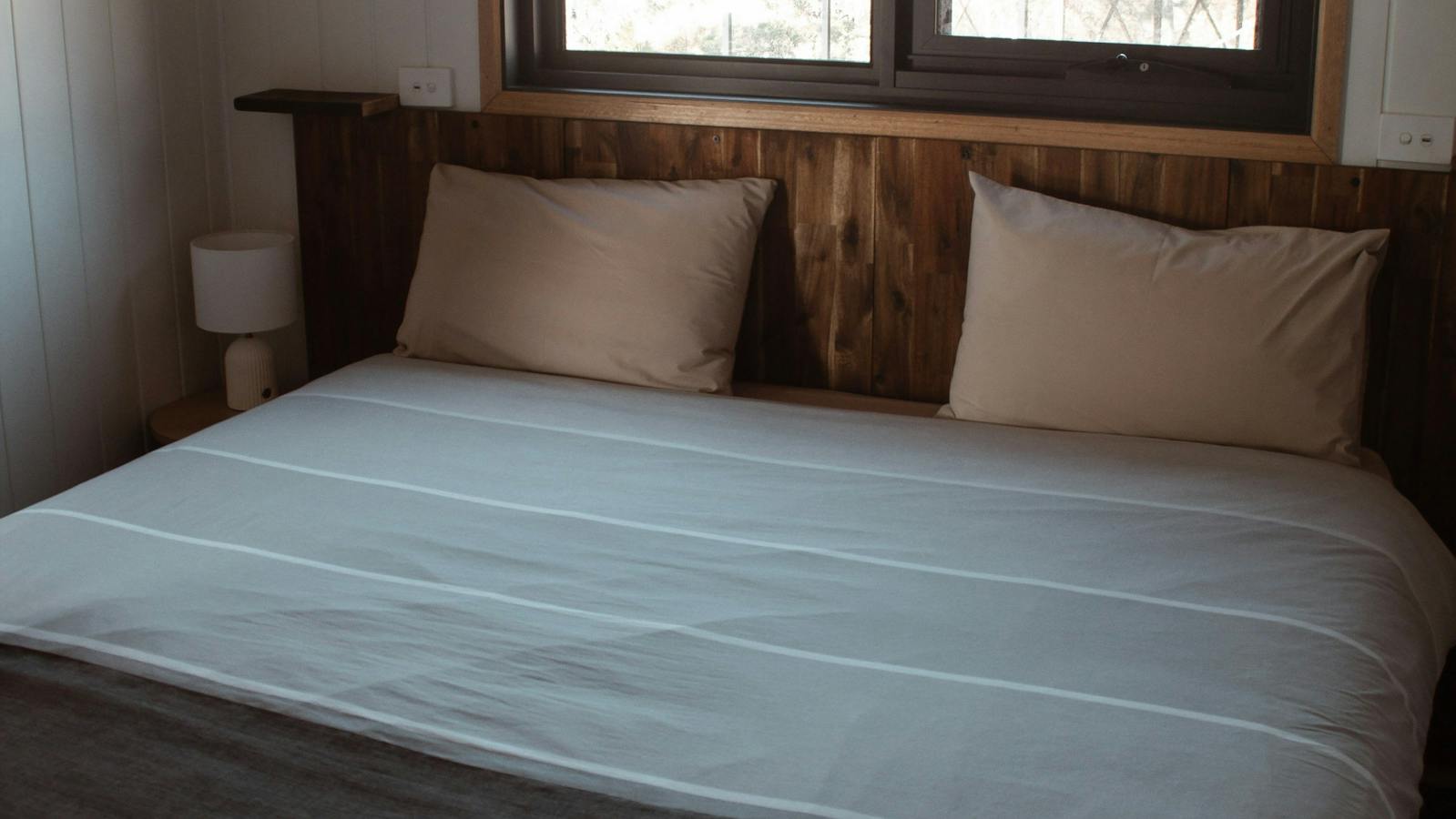 Comfortable bedroom with queen bed and mountain views