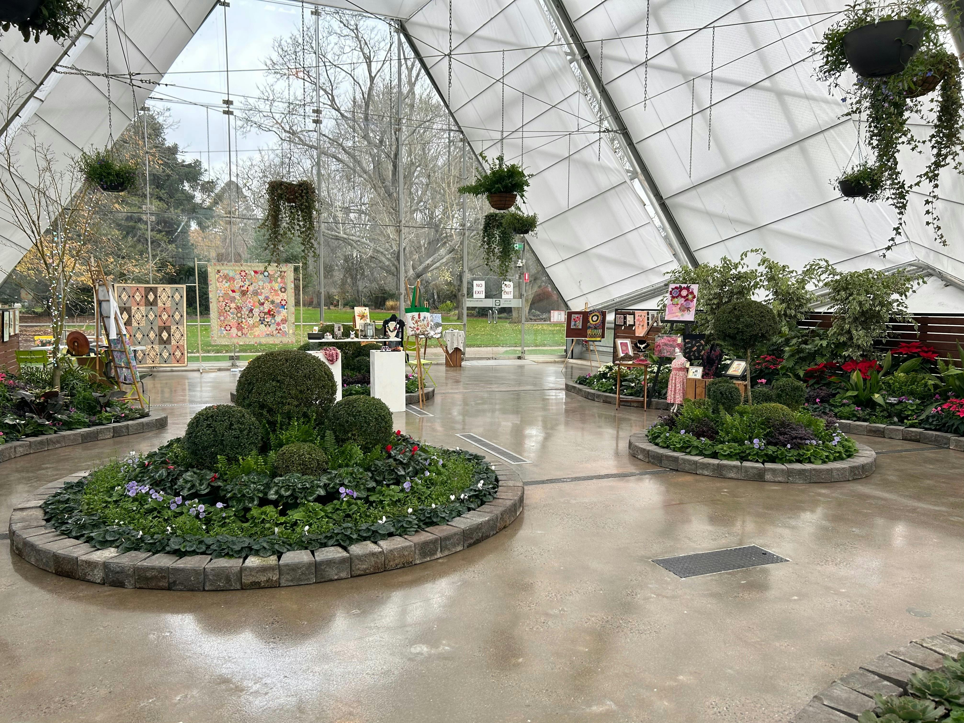 Conservatory with craft stalls and displays