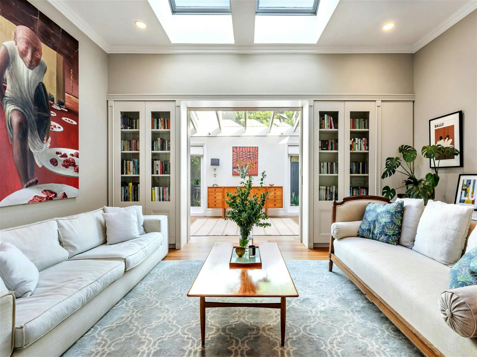the oversized immaculate kitchen, adjacent to the dining room and living room