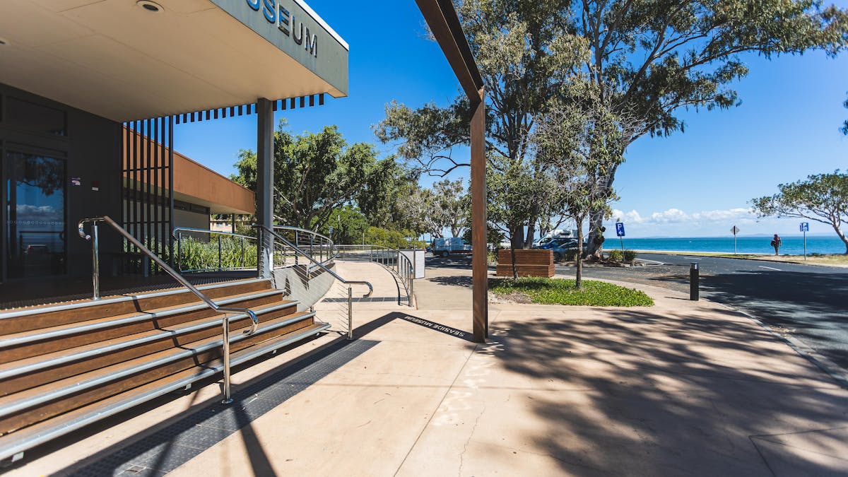 Front entrance of museum with view of water