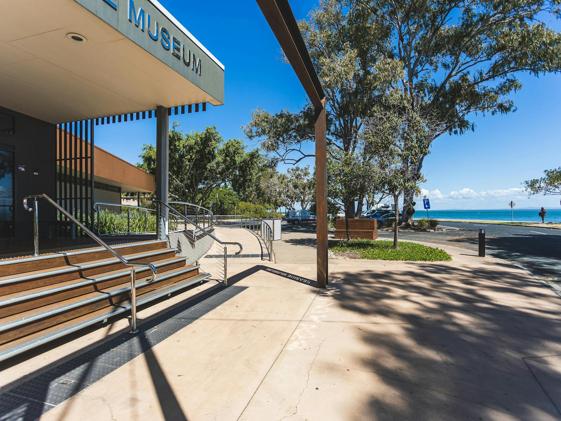 Front entrance of museum with view of water